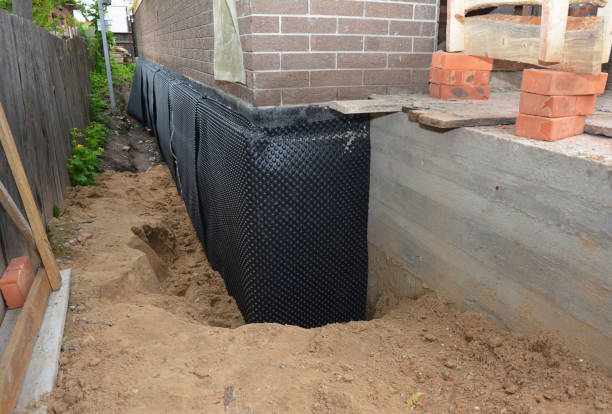SJ Waterproofing Pros technician performing targeted Emergency Waterproofing assessment in Bohemia, NY